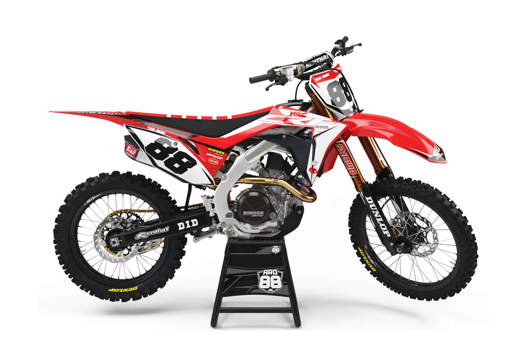 Honda-crosshoj med dekalkitet Factory White – röd grafik med vita nummerytor och stora svarta siffror