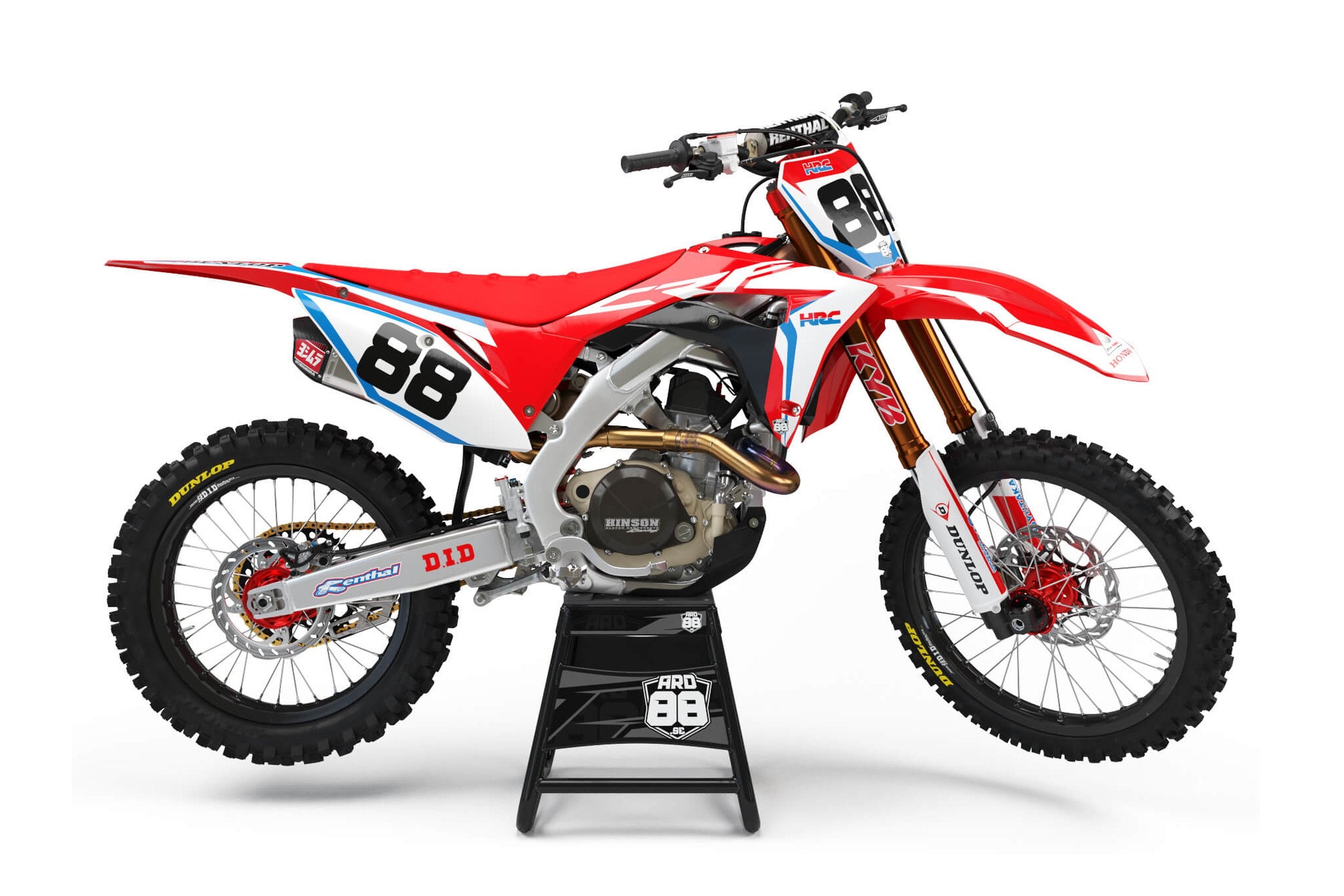 Honda-crosshoj med dekalkitet Race Replica Red – röd grafik med vita nummerytor, blå kanter och stora svarta siffror