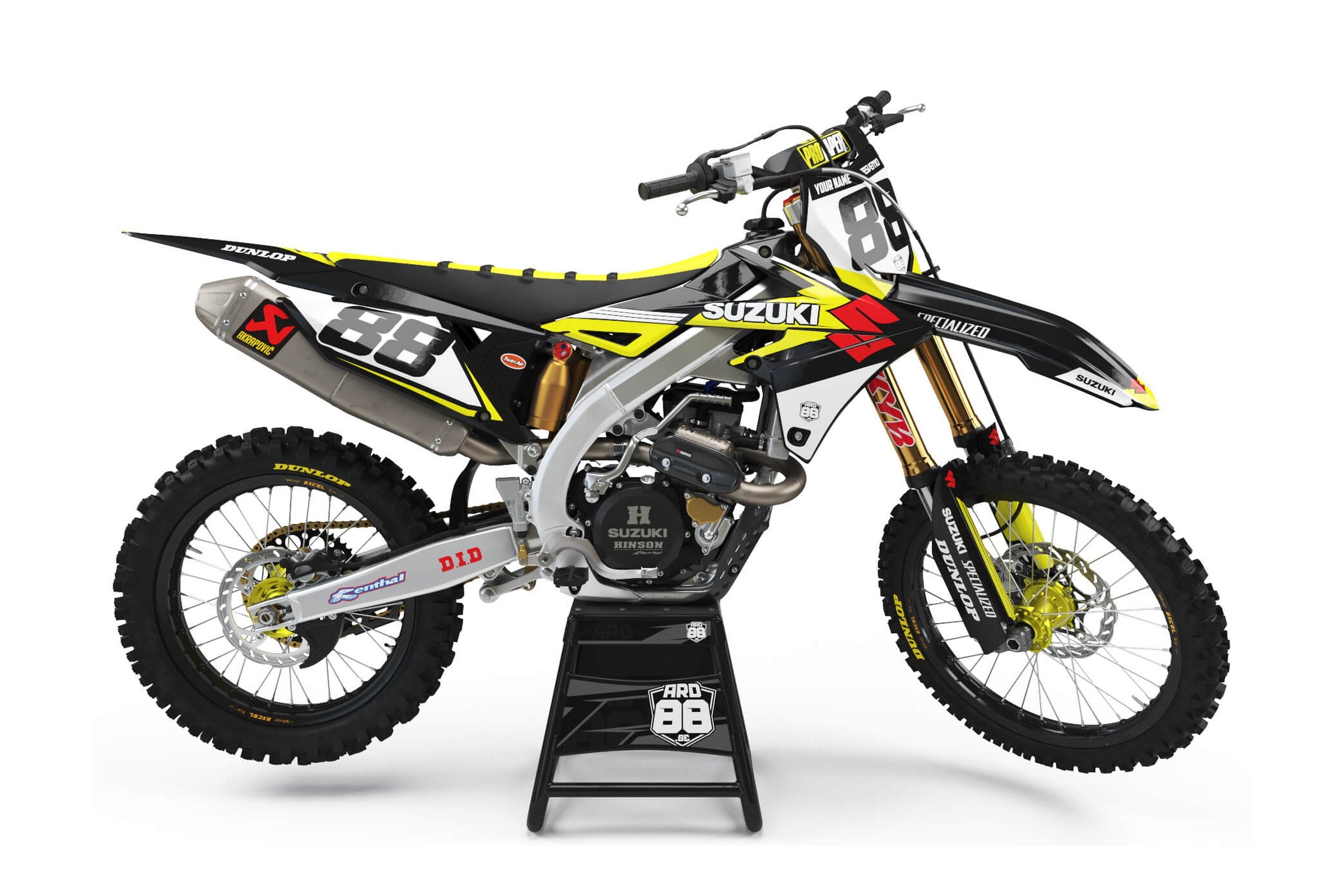 Suzuki crossmaskin med dekalkitet Team Red i svart och vitt med neongula detaljer och svarta siffror 88 mot vitt
